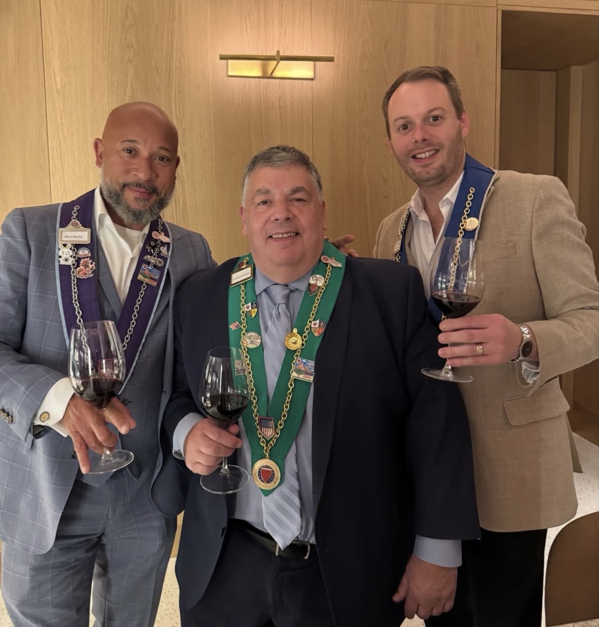 Chaîne members toasting with wine